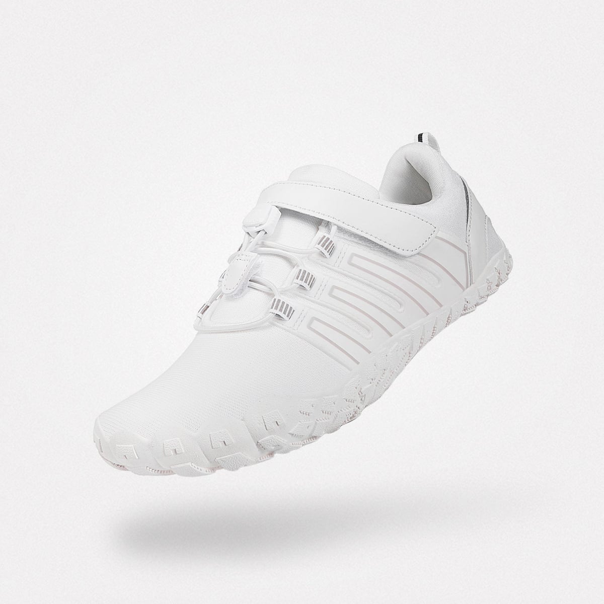 A white minimalist barefoot shoe showing its wide toe box and flexible zero-drop sole